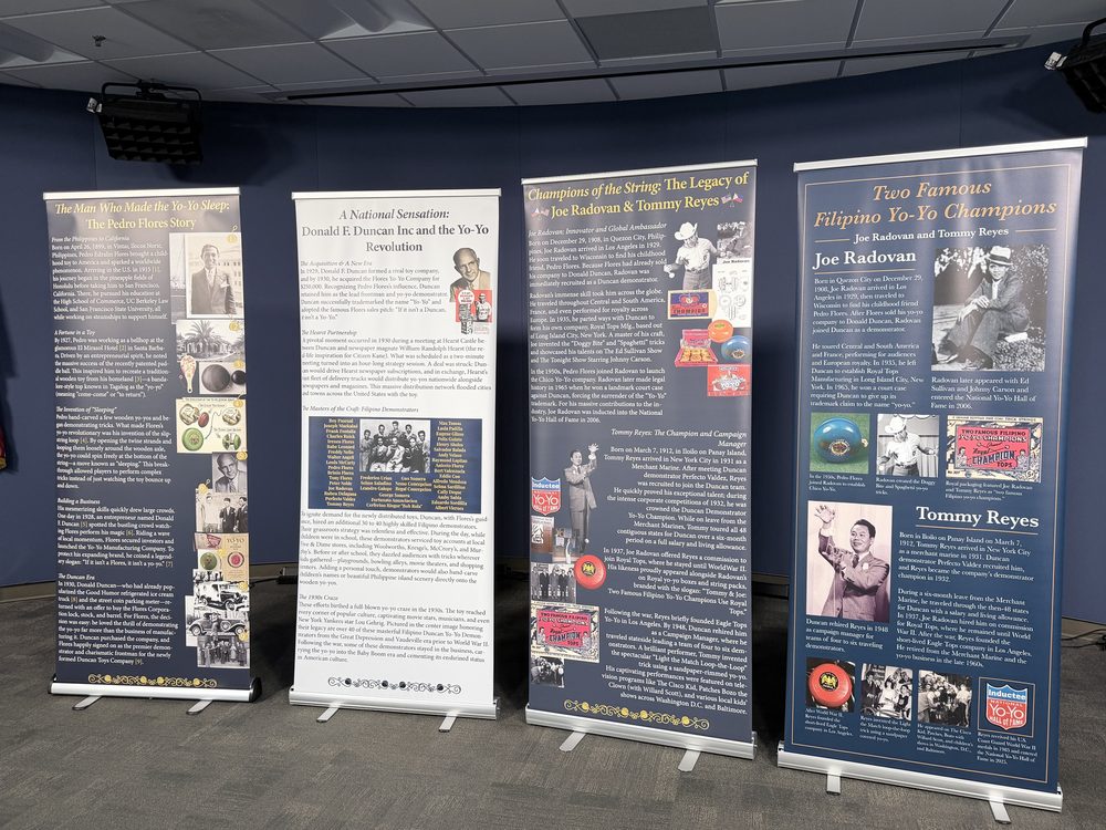 The same four yo-yo history banners set up in a second exhibit room