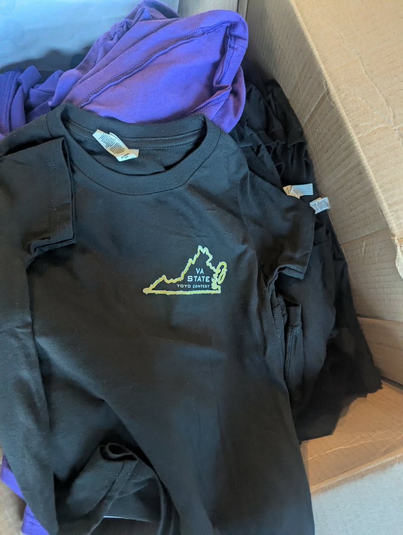 Black t-shirt with a small embroidered VA State Yo-Yo Contest logo on the chest