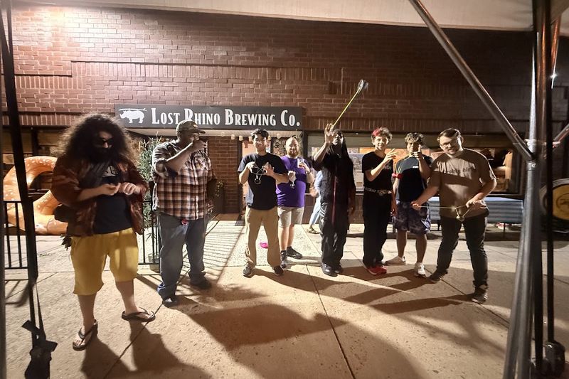 Throwers keep playing at night outside Lost Rhino Brewing Co. after the contest